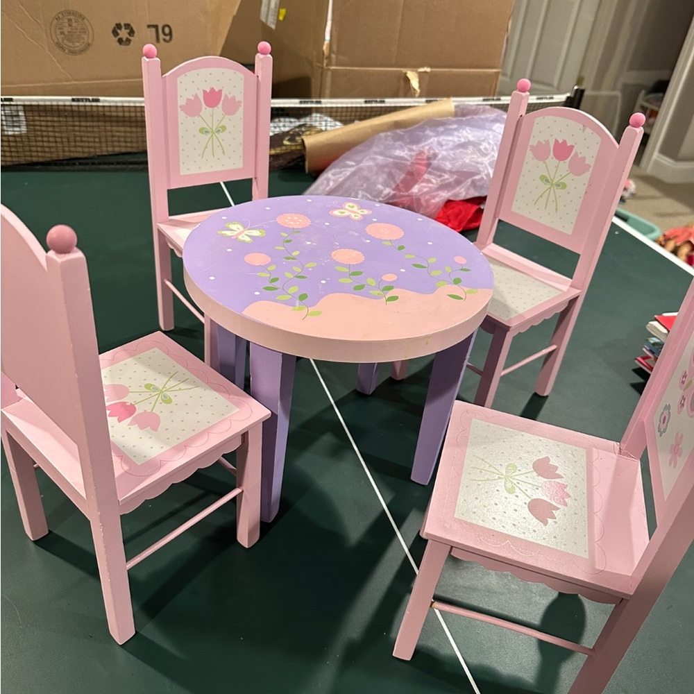 table and chair set + a couple accessories for ur dolls!